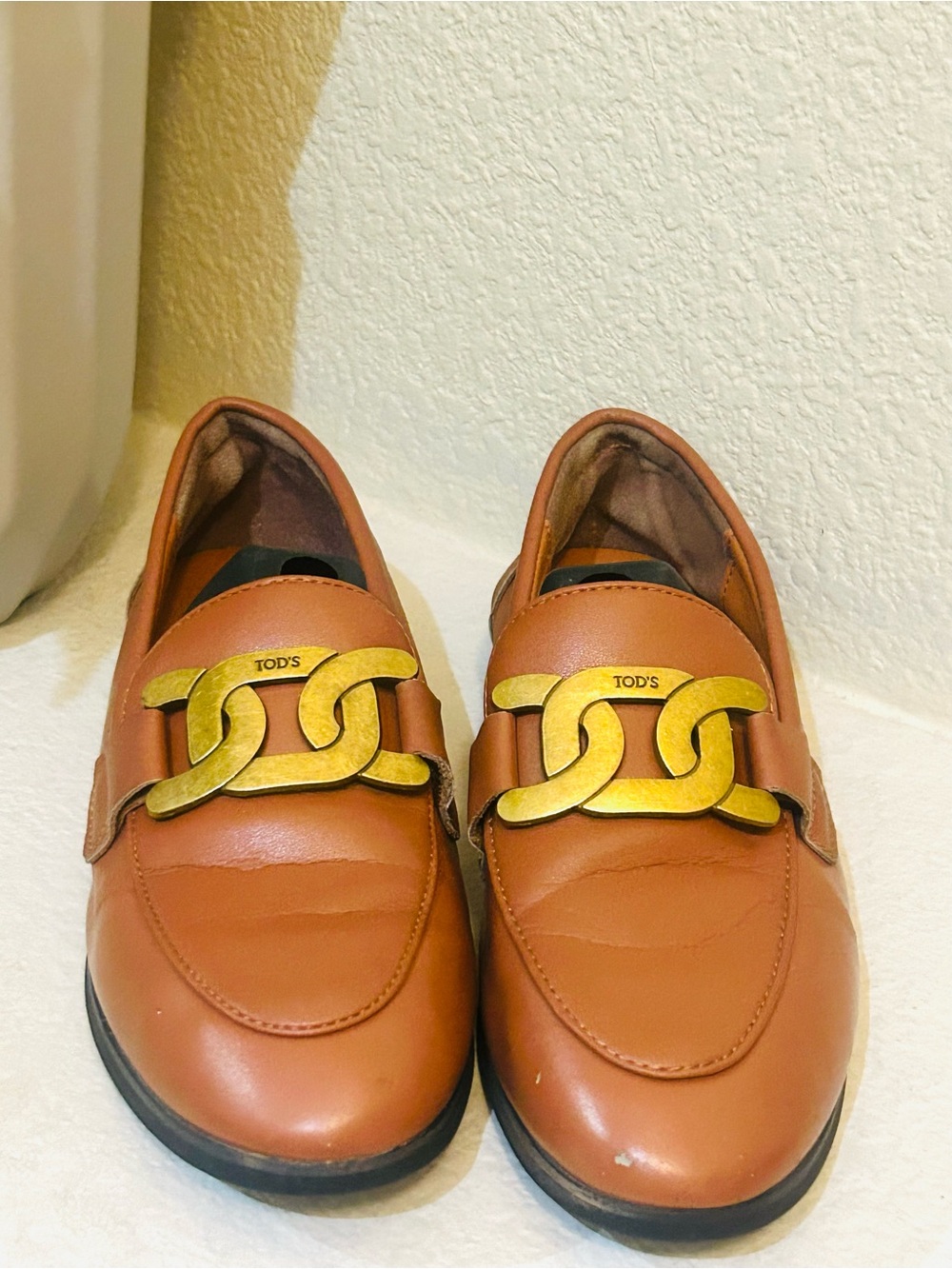 TOD'S Cognac Leather Loafers with Gold Chain Accent